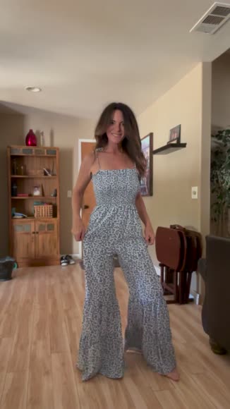Video review of PALERMO Thin Straps Smocked Bodice Wide Leg Floral Jumpsuit  by 67608b715eefd0d84939c341