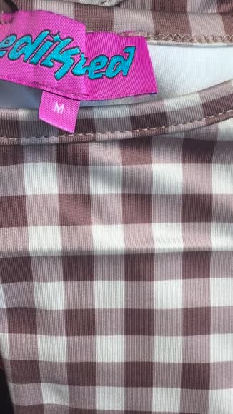 Video review of Edikted Flower Field Gingham Tank Top  by 67d18f6f17cb7060e6cd860a